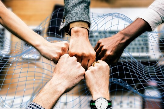 Diverse colleages giving a fist bump
