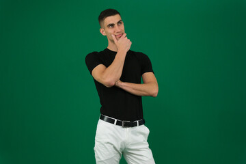 Collection of videos with fit European man in black t shirt and white pants on green chroma key background expressing various emotions smiling thinking surprised serious and confident poses.