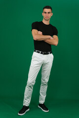 Collection of videos with fit European man in black t shirt and white pants on green chroma key background expressing various emotions smiling thinking surprised serious and confident poses.
