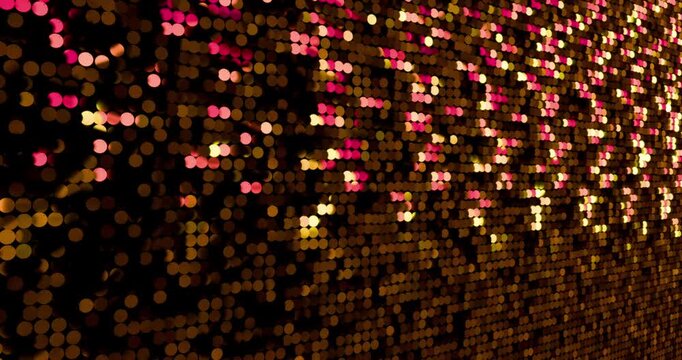 Gold sequins turn up in a random pattern. Side macro view of gorgeous waving pattern background. 4K 3D rendering loop animation.