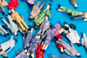 Miniature figures create a vibrant display of chaos and diversity on a bright backdrop