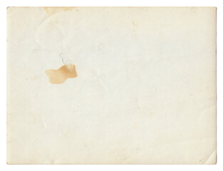 Vintage background of old ancient torn paper texture with spots. Old paper as background. Interesting texture of old yellowed paper slightly damaged by mold. Unique vintage texture of old paper.