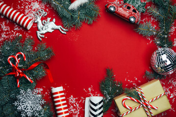 Christmas composition with gifts on a red background.