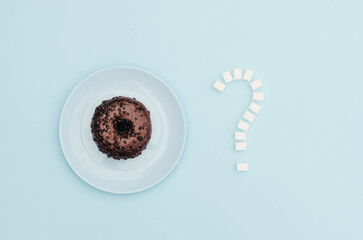 A donut with sugar on a blue background.