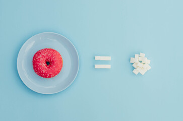 A donut with sugar on a blue background.