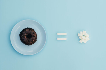 A donut with sugar on a blue background.