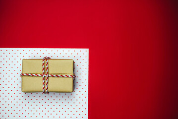 Christmas composition with gifts on a red background.