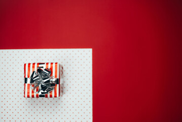 Christmas composition with gifts on a red background.