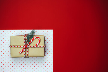 Christmas composition with gifts on a red background.