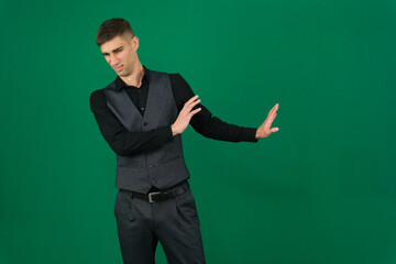 Professional collection of attractive European man in elegant business suit vest and black shirt green chroma key background expressing various emotions gestures and confident movements ideal for ad