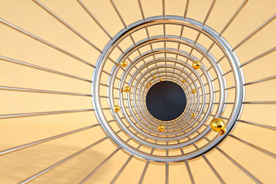Spiral metal tunnel with golden spheres