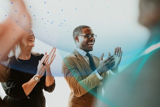 Diverse business people applauding with joy