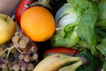 A colorful assortment of various fruits and vegetables is in a basket