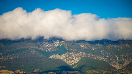 Orographic cloud or cap cloud cover forming over Montes Obarenes near Frias in Spain