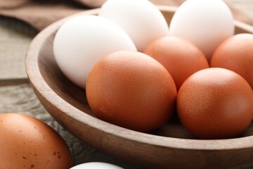 Fresh raw chicken eggs on table, closeup
