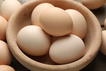 Fresh raw chicken eggs on table, closeup