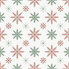 Seamless christmas snowflake pattern with red and green festive winter design