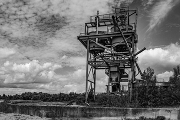 Dilapidated and abandoned industrial installation in monochrome