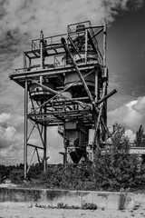 Dilapidated and abandoned industrial installation in monochrome