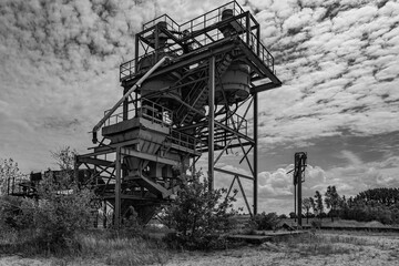 Dilapidated and abandoned industrial installation in monochrome