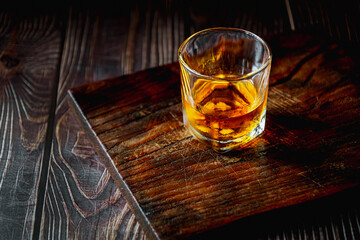 Strong alcohol drink. Whisky in glass, liqueur, bourbon or cognac. Hard strong alcoholic drink