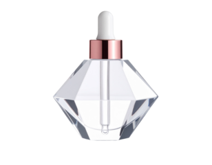 Transparent dropper bottle shaped like a gemstone crystal prism, metallic rose cap PNG