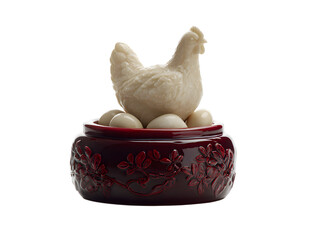 White hen figurine on red ceramic bowl with eggs chicken