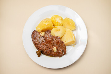 Fried Liver with boiled potato on plate