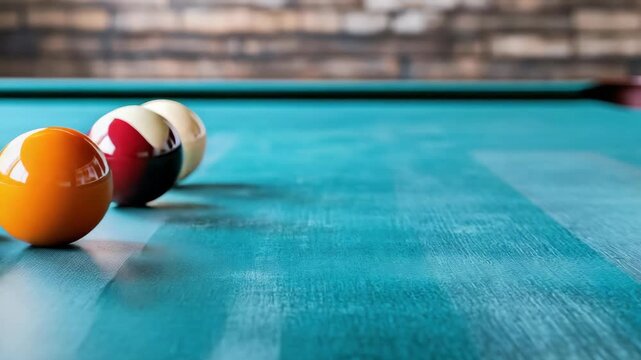 Vibrant orange and teal billiard balls create stunning game scene on pool table