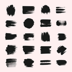 Collection of twenty black ink brush strokes and splatters on a light pink background grunge