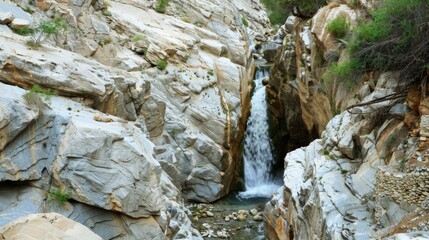 Natural Waterfall Wonders: Flowing Streams, Forested Mountains, and Moss-Covered Rocks in Outdoor Landscapes