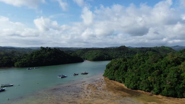 Wide aerial panorama of the tranquil lagoon surrounded by hills at Sendang Biru bay and Pulau Sempu island east java provinces malang city indonesia.