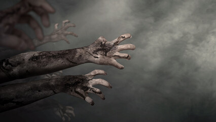 Zombie hands with wounds and blood reaching out from a dark background. Zombie, devil, evil, satan, or monster hand. Dramatic smoke or fog effect. Concept of Spooky Halloween