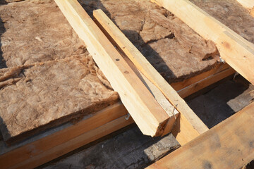 House roof insullation with minelall wool during roofing construction