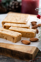 Christmas soft almond nougat bar with christmas decoration on wooden table