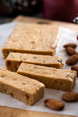Christmas soft almond nougat bar with christmas decoration on wooden table