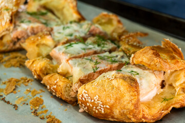 Puff pastry and salmon roll. Baked salmon in dough. Diet. Food concept