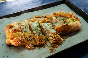 Puff pastry and salmon roll. Baked salmon in dough. Diet. Food concept