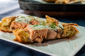 Puff pastry and salmon roll. Baked salmon in dough. Diet. Food concept