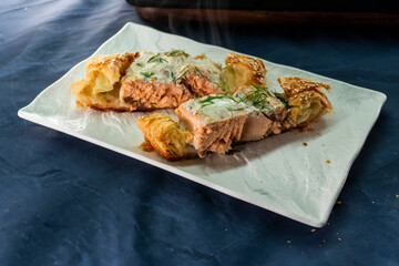 Puff pastry and salmon roll. Baked salmon in dough. Diet. Food concept