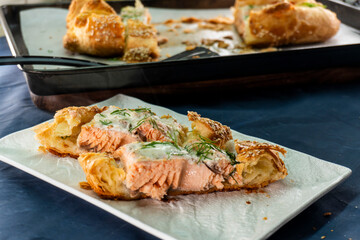 Puff pastry and salmon roll. Baked salmon in dough. Diet. Food concept