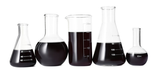 Different laboratory glassware with black liquid isolated on white