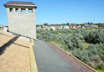 Roofing construction. Asphalt shingles laying on house roof osb board and waterproof roof underlayment