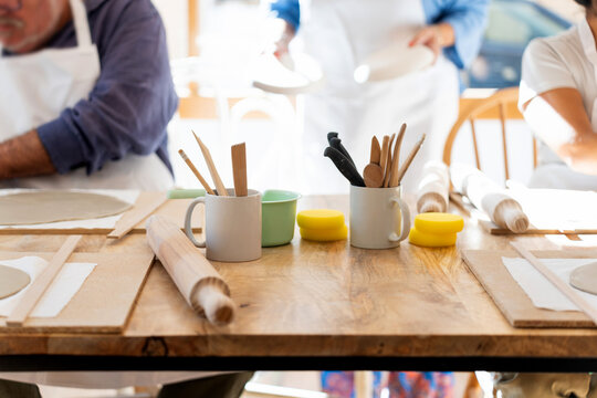 People learning pottery at ceramics workshop