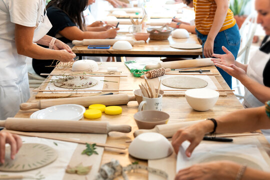 People taking ceramics pottery class workshop