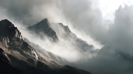 Mountain pass shrouded in clouds morning light minimalist