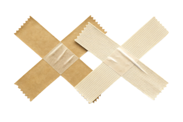 Two adhesive bandages crossed in X formation, tan fabric texture with center pads, serrated edges, isolated on a transparent background