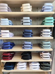 Folded Dress Shirts Display on Wooden Shelves in Clothing Store