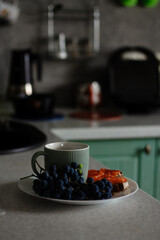 a cup of coffee in the kitchen, breakfast with red fish