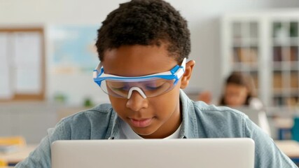 Personalized Learning Edtech Concept. Focused student using a laptop in a classroom setting. - Powered by Adobe